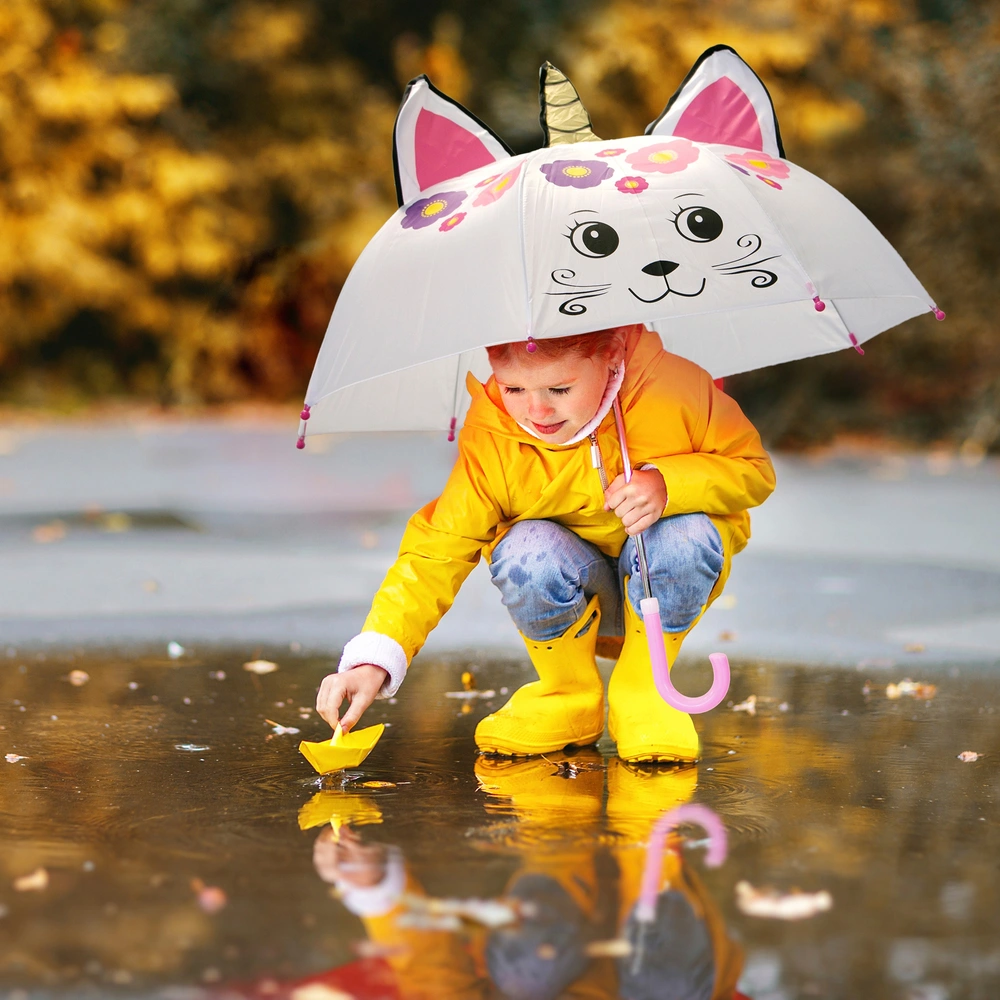 Happy kids with colorful umbrellas in the rain